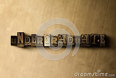 UNDERGRADUATE - close-up of grungy vintage typeset word on metal backdrop Cartoon Illustration