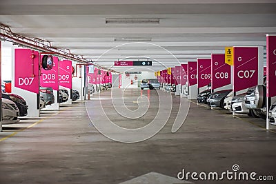 Underground interior garage parking lot with many cars Stock Photo