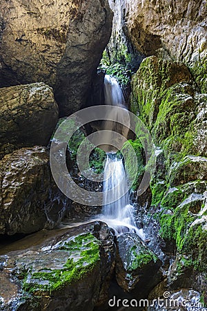 Underground river and waterfall in Romania Stock Photo