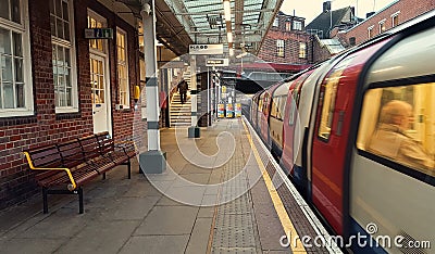 Underground subway station of Kingsbury, train approaching in London city, United Kingdom. Editorial Stock Photo