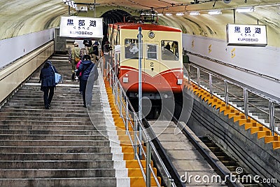 Underground Tram On Steep Slope And People Climbing Up In The Tunnel Editorial Stock Photo