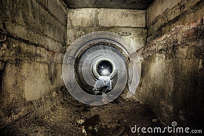 Underground urban sewage collector connected by round drainage sewer tunnel Stock Photo