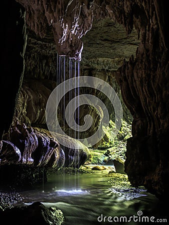 Waitomo Cave Underground Waterfall Scene in New Zealand Stock Photo