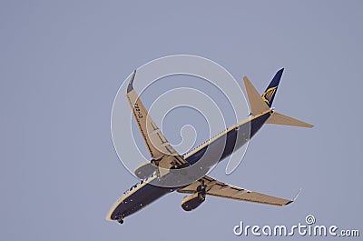 Underside view of an airplane in flight. Editorial Stock Photo