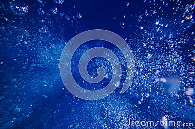 Underwater bubble shot in deep blue tropical sea Stock Photo