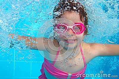 Underwater little girl blue swimming pool Stock Photo