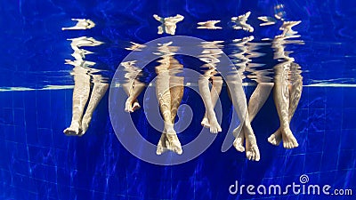 Underwater photo of bare feet in swimming pool Stock Photo