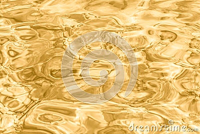 Underwater shallow waves rippling gold color water in a sea background Stock Photo