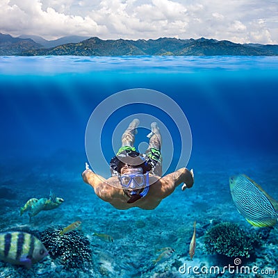Underwater shoot of a young man snorkeling in a tropical sea on Stock Photo
