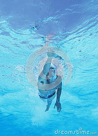 Underwater shot of professional male athlete swimming in pool Stock Photo