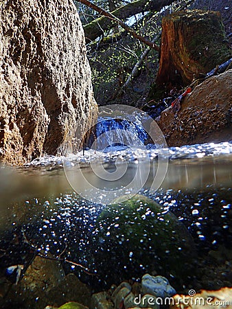 An underwater and water uptake by a stream Stock Photo