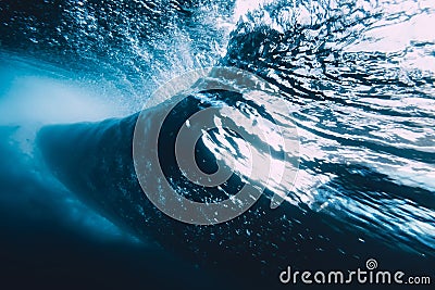 Underwater wave with sun light. Barrel wave crashing in ocean Stock Photo