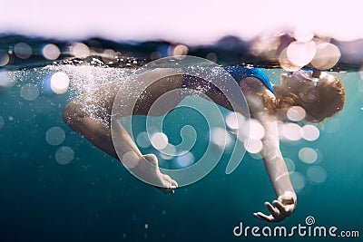 Underwater woman with bubbles in ocean Stock Photo