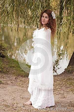Undine, coming out of the river in thickets Stock Photo