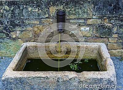 Undrinkable water coming from a fountain Stock Photo