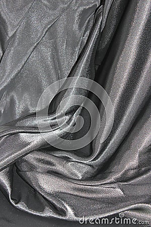 Undulating folds of the fabric of gray silk Stock Photo