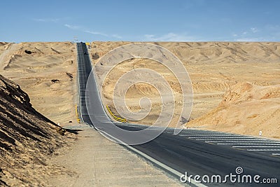 Undulating road in desert wilderness Stock Photo