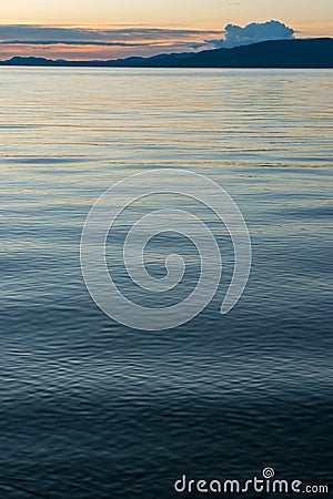 The undulating waters of Stuart Lake at dusk at Paaren`s Beach Provincial Park, British Columbia, Canada Stock Photo