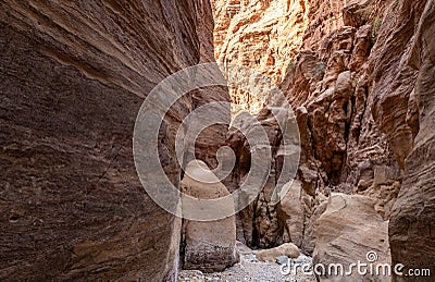 The unearthly beauty of high mountains on sides of gorge of tourist route of the gorge Wadi Al Ghuwayr or An Nakhil and the wadi Stock Photo