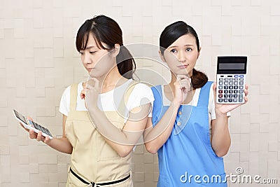 Uneasy Asian women Stock Photo