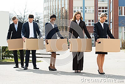 Unemployed Businesspeople With Cardboard Boxes Stock Photo