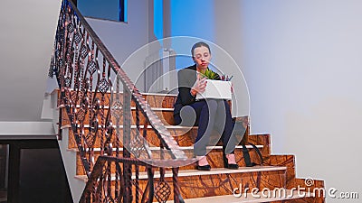 Unemployed businesswoman holding box of stuff Stock Photo