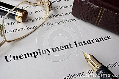 Unemployment insurance written on a paper. Stock Photo