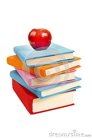 Uneven Stack Of Books With Red Apple Stock Photo