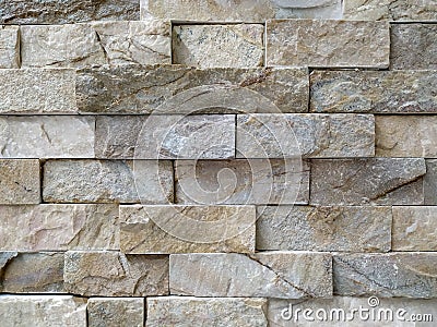 Uneven surface of modern style architecture rough texture stone in contemporary textured masonry for interior or exterior Stock Photo
