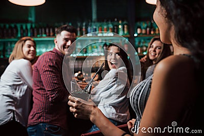 Unexpected meeting. Beautiful youth have party together with alcohol in the nightclub Stock Photo