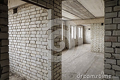 Unfinished apartment in a white sand-lime brick building Stock Photo