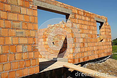 Unfinished brick house Stock Photo