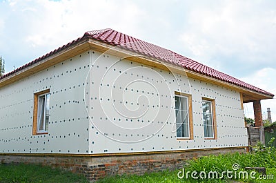 Unfinished house insulation ready for plastering wall with fiberglass mesh, plaster mesh, rigid foam insulation. Stock Photo
