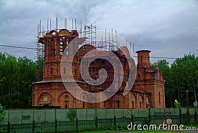 The unfinished Orthodox Church among the trees Stock Photo