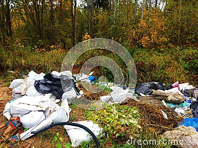 Unfocused background, large heaps of garbage along the road Editorial Stock Photo