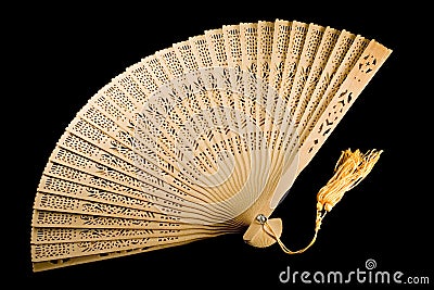 Unfolded ancient fan isolated on black Stock Photo