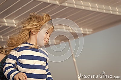 Unforgettable family vacation at sea. Child happy face striped shirt sailor. Child enjoy vacation on cruise ship. Family Stock Photo