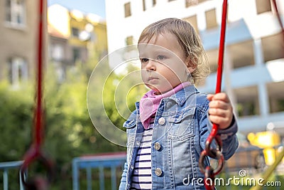 The unfortunate little girl on the playground Stock Photo