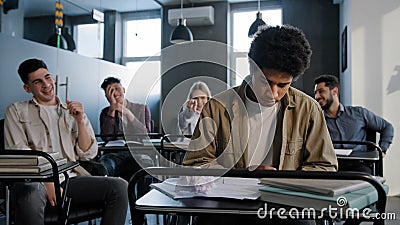 Unhappy african american student loser feeling mocking bullying anger from classmates suffering from abuse young upset Stock Photo