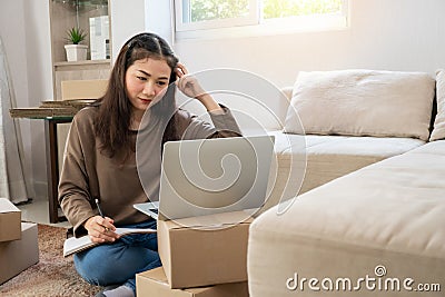 Unhappy Asian young entrepreneur, Tired expression And fed up with problems in doing business at home office, Concept of merchant Stock Photo