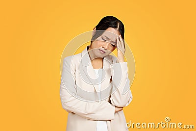 Unhappy asian young woman, with pained expression, clutching forehead, suffer from headache Stock Photo