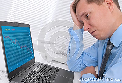 Unhappy businessman with a laptop Stock Photo