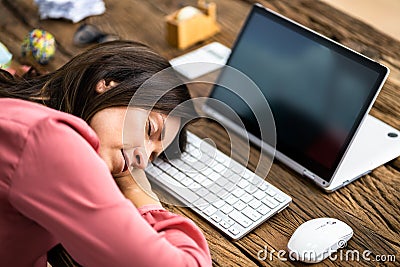 Unhappy Businesswoman Sleeping In Office Stock Photo