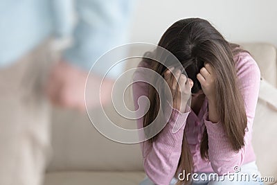 Unhappy couple breaking up, man leaving sad woman, domestic abus Stock Photo