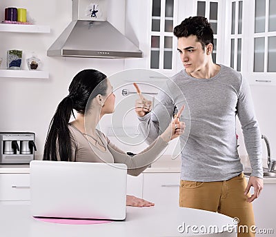 Unhappy couple in the kitchen Stock Photo