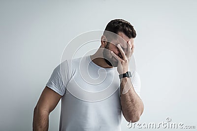 Unhappy depressed male cry, feel desperate and lonely, in stressed from work, unemployment, anxiety Stock Photo