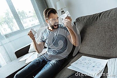 Unhappy emotional man being stressed out Stock Photo