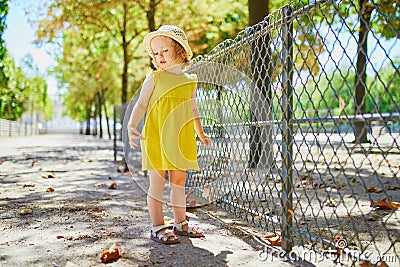 Unhappy and emotional toddler girl in park Stock Photo