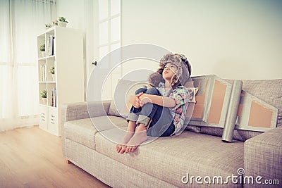 Unhappy female children playing as astronaut Stock Photo