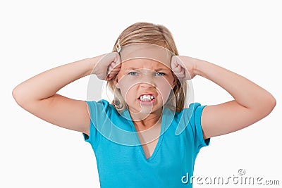 Unhappy girl with the fists on her face Stock Photo